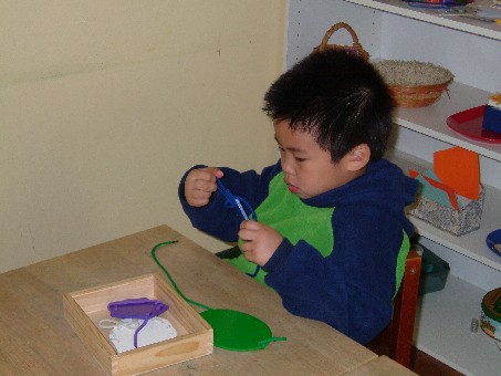 Nicholas works with threading boards