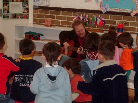 With guitar in hand!